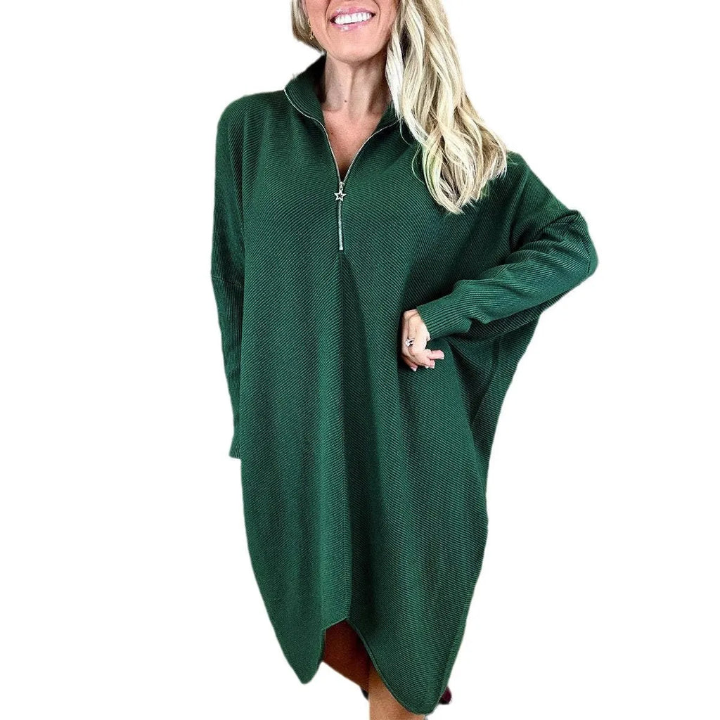 Women's solid colour loose knitted dress with a zipper detail on a hanger.