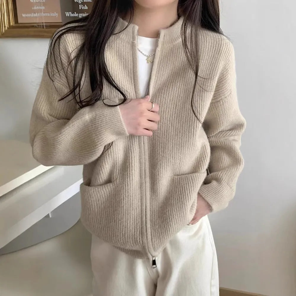 A beige soft glutinous sweater coat cardigan with long sleeves, shown buttoned.