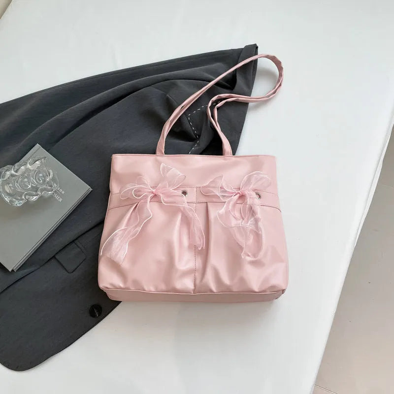 College style bow tote bag in black with large capacity, PU material, and double shoulder straps