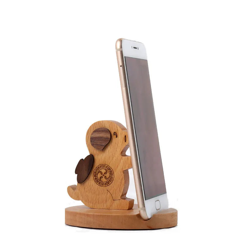 Beech wood mobile phone holder with resin animal design and coin slot
