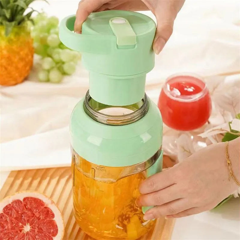 Portable electric juicer 1500ml USB rechargeable in pink with double handles and steel blades