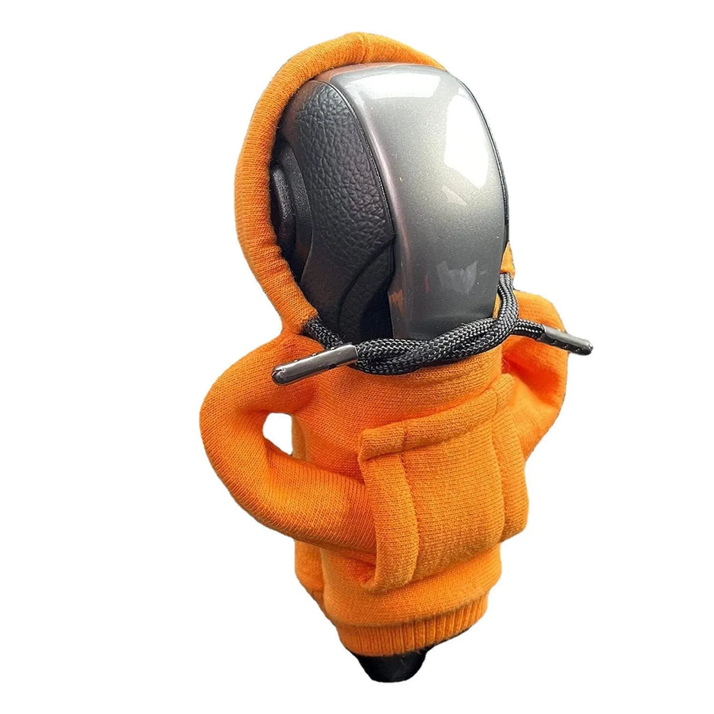 Cloth gear shift knob hoodie cover in various colours on a car gear stick.