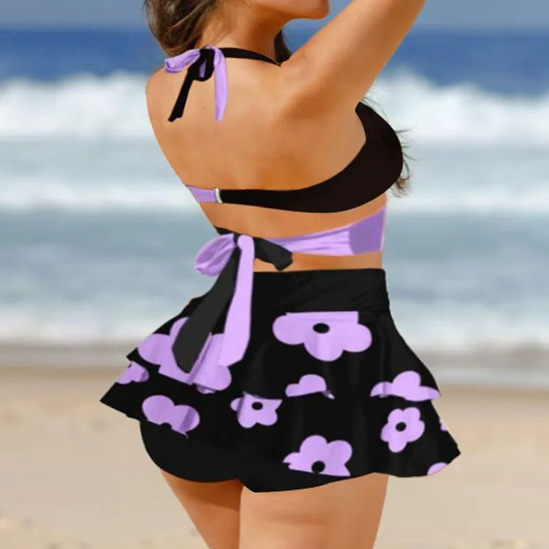 Women's purple bikini swimsuit with split skirt and lace-up detail, high waist backless design