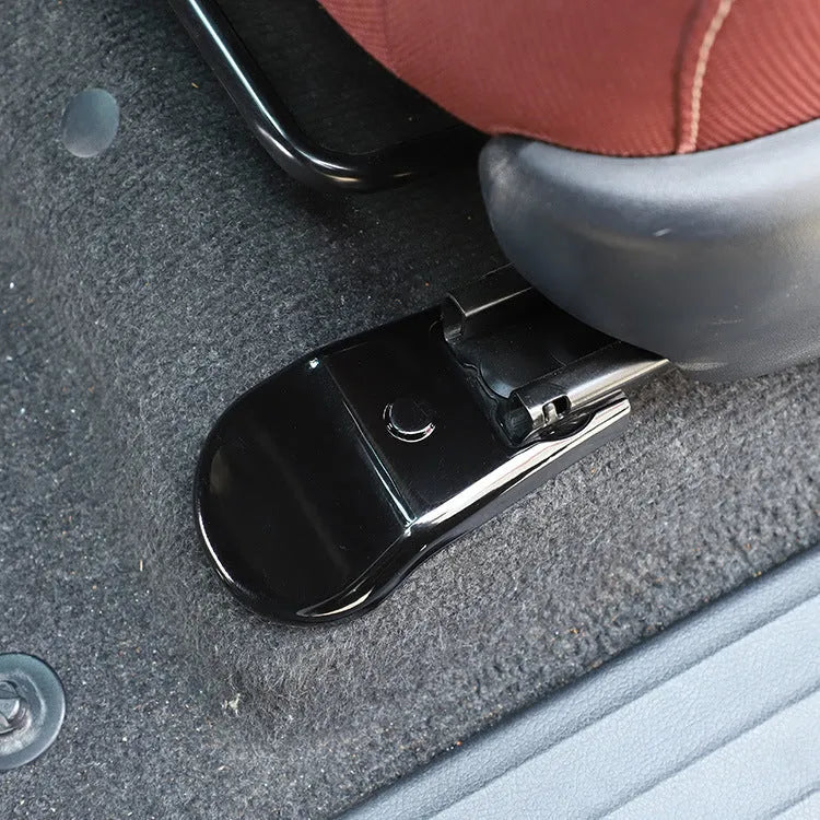 Black plastic seat feet screw decoration covers for 15-21 Toyota Hi Lux, 4 piece set on a white background
