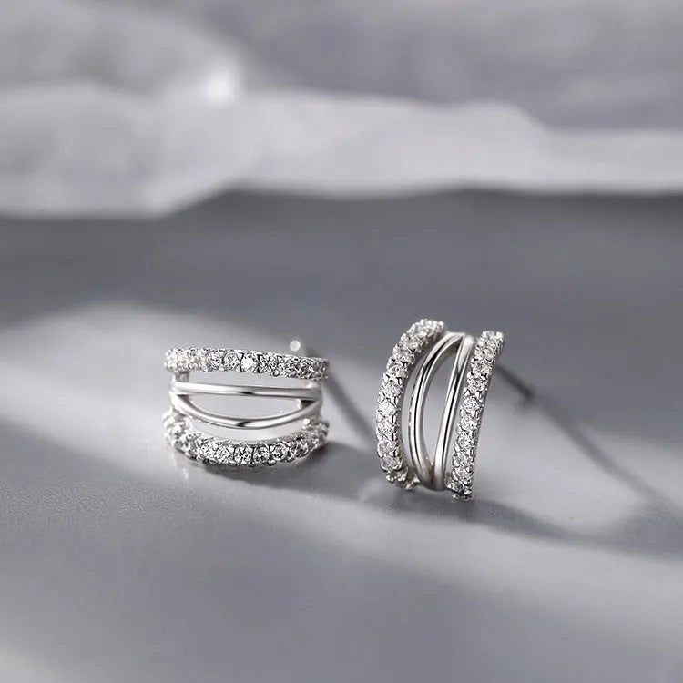 A pair of geometric-shaped 925 silver tone earrings with hypoallergenic needle studs, shown in large size.