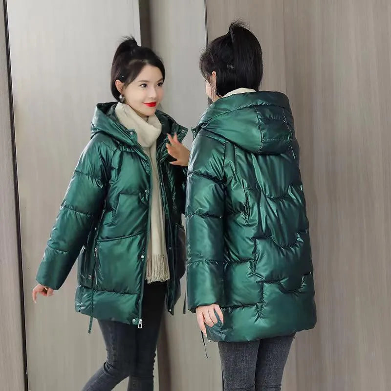 Women's loose fit thick hooded winter jacket in blue, shown on a model.