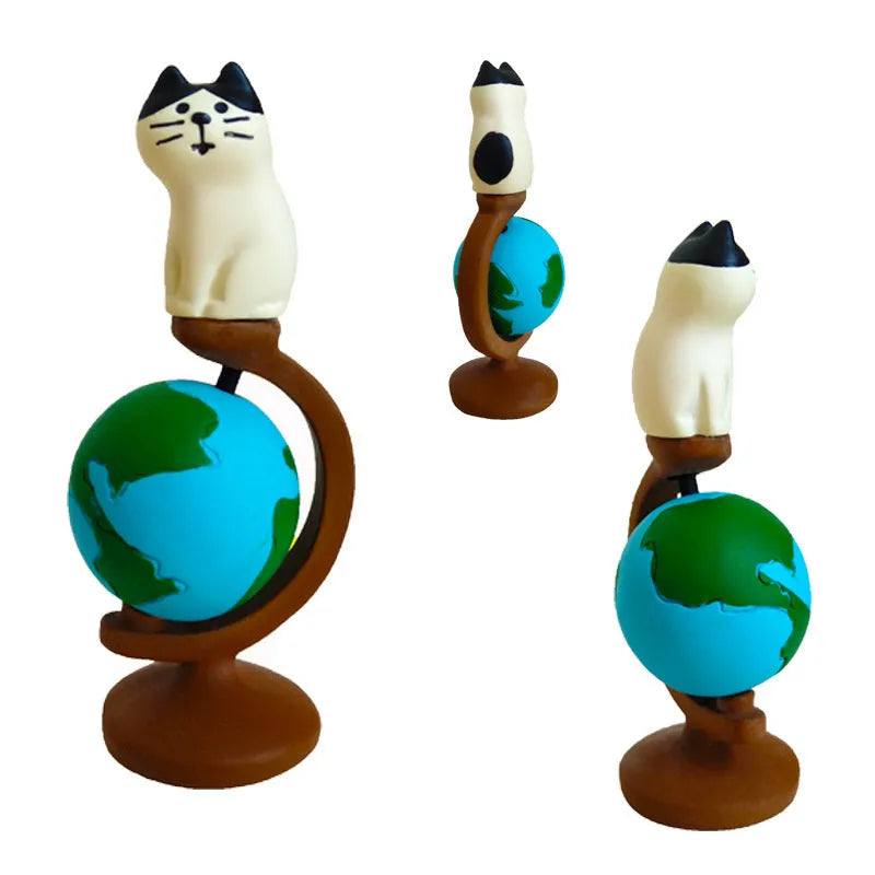 Resin cat figurine with Statue of Liberty hat and travel globe, cartoon style, carp cat variant