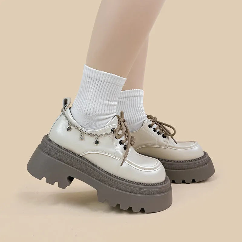 White women's Mary Jane platform shoes with thick chunky heel and front lace-up detail.