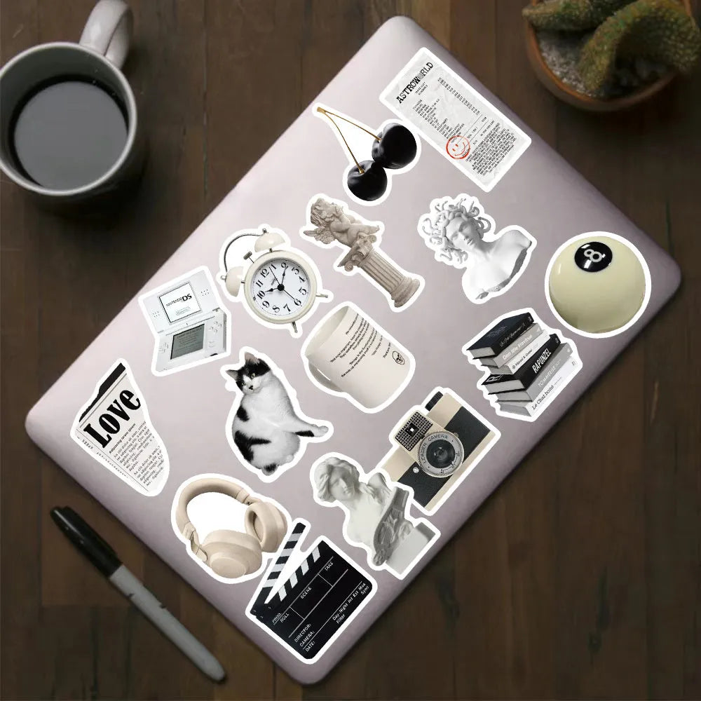 61 black and white PVC waterproof stickers on a sheet for laptops, phones and luggage