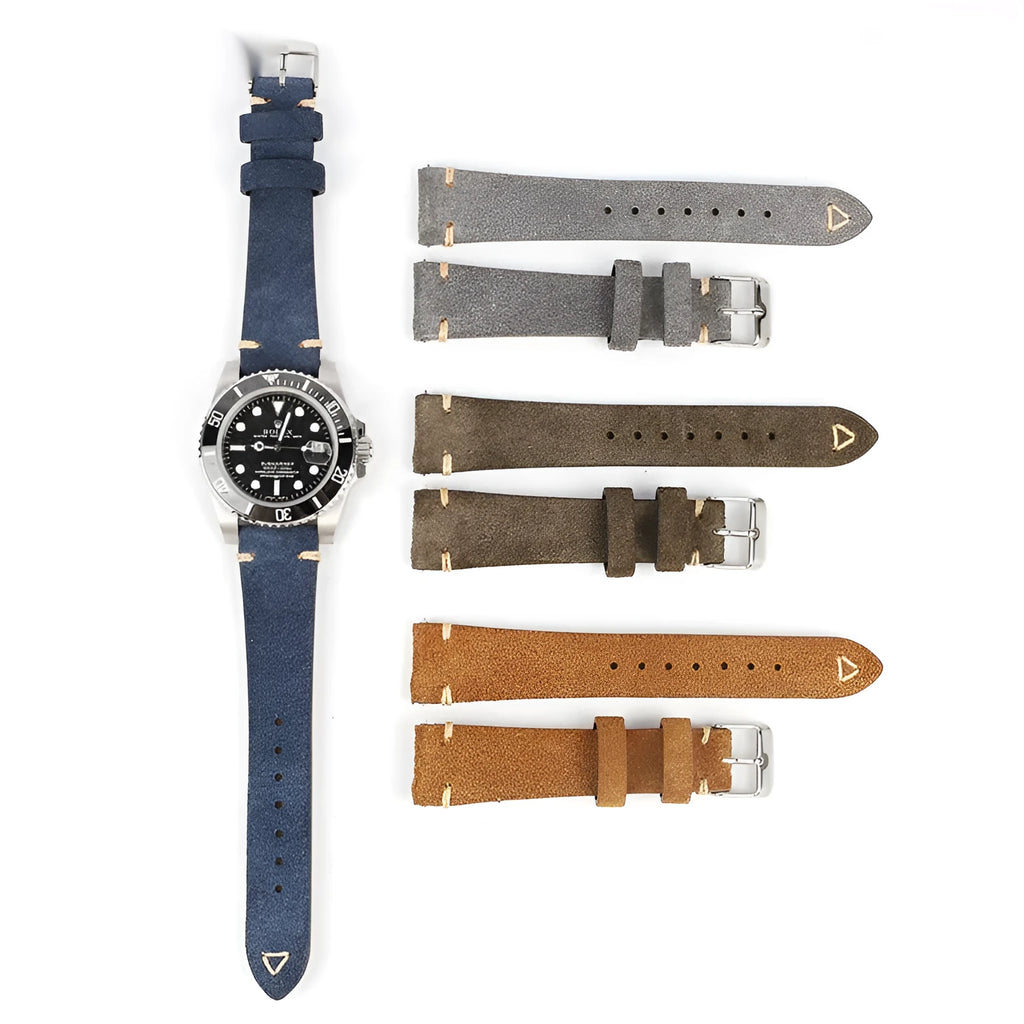 Brown genuine suede leather watch strap showing textured surface and buckle, laid flat.