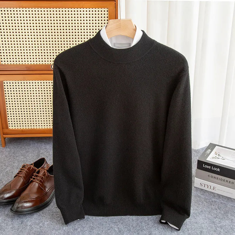 Man wearing a loose-fit half-turtleneck wool sweater in a neutral colour.