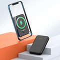Portable magnetic wireless charging power supply 5000mAh in white, showing slim plastic shell and compact size