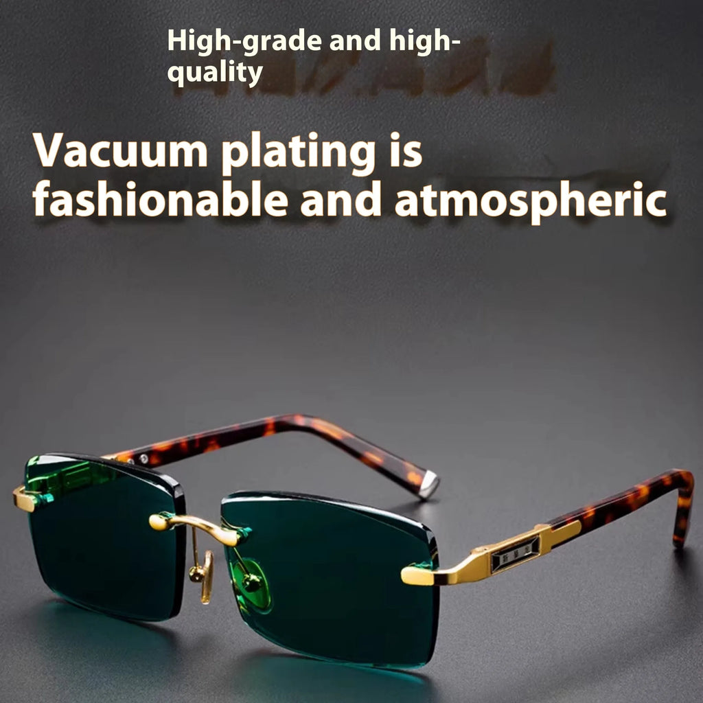 Dark green frameless crystal sunglasses with a distinctive design, shown with a hard case and lens cloth.