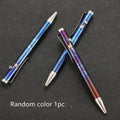 Titanium alloy gun bolt handle ball pen with magic colour phantom finish on a desk.