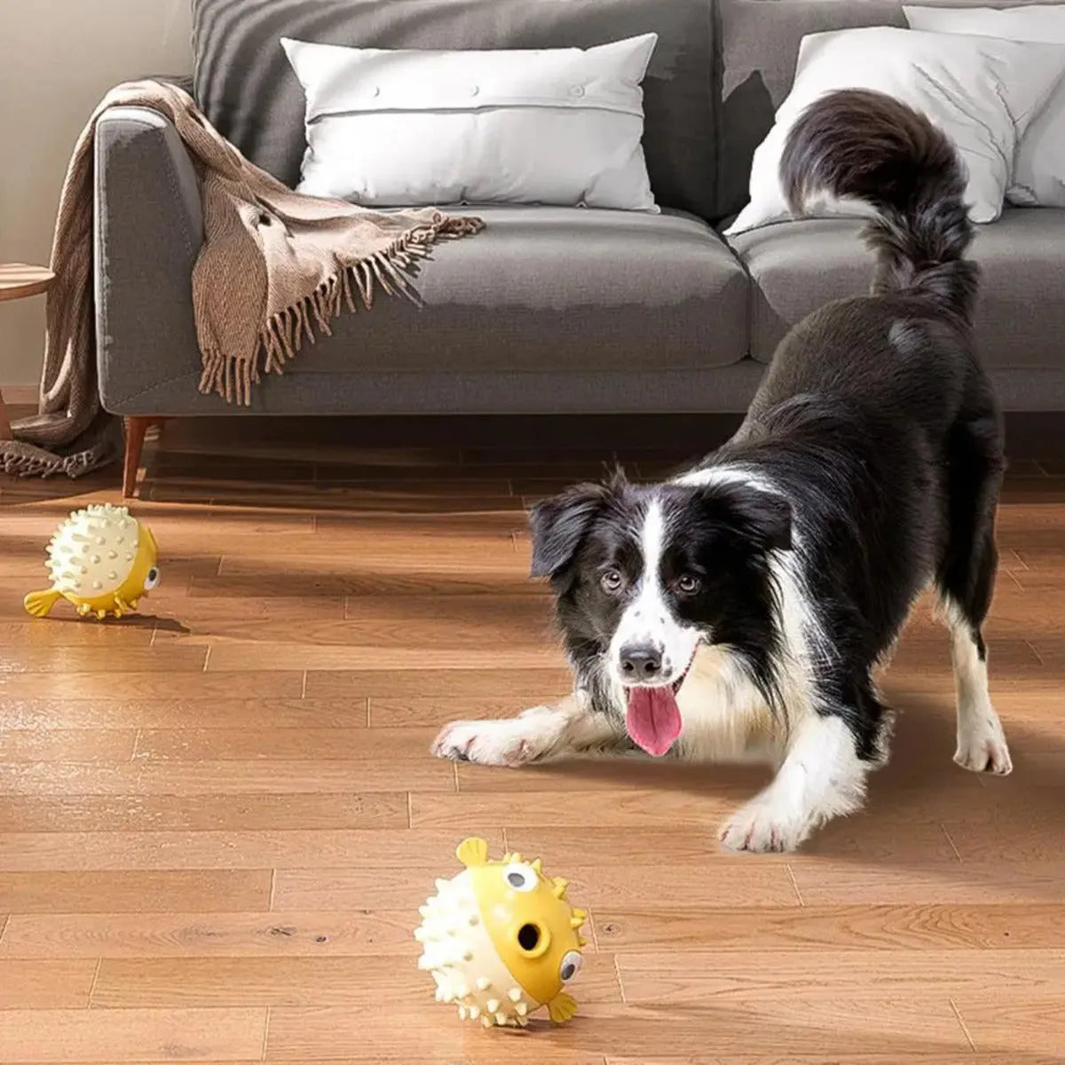 Yellow fish-shaped vinyl dog chew toy with textured surface and squeaker.