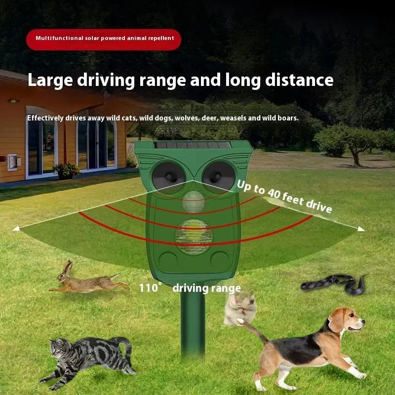 Dark green solar-powered infrared animal repeller with plastic body on grass