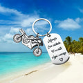 Stainless steel inspirational motorcycle keychain with metal ring and flannel storage bag.