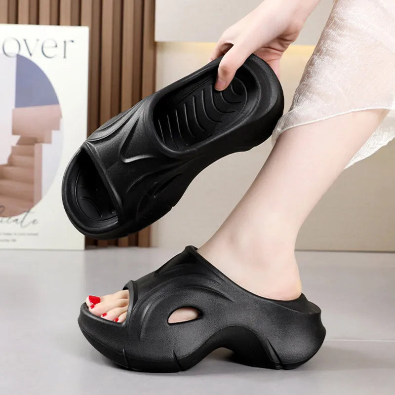 Women's white EVA beach slippers with a thick sole and round toe.