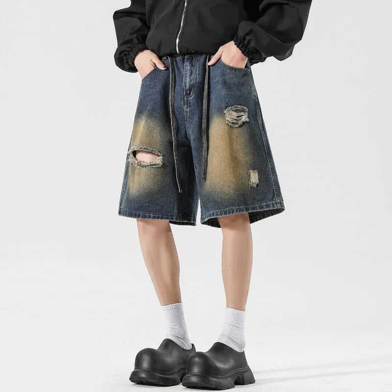 Retro blue denim jeans with ripped detailing, loose straight-leg fit, American high street street style.