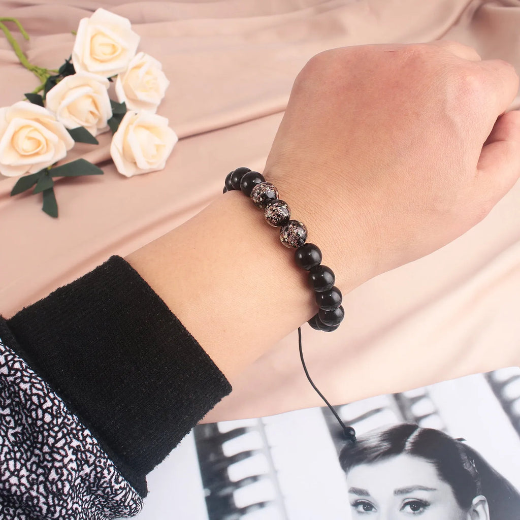 Beaded adjustable luminous bracelet in six colours: black, red, green, pink, blue, sapphire blue, glass or coloured glaze beads, geometric shape