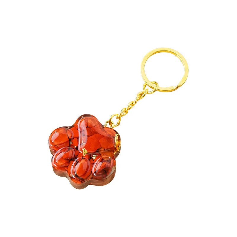 Natural crystal cat's paw keychain pendant in various gemstone colours including pink, red, green and blue variants