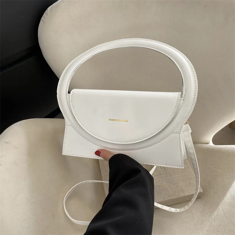 PU leather messenger bag in horizontal square shape with phone compartment and stitching detail