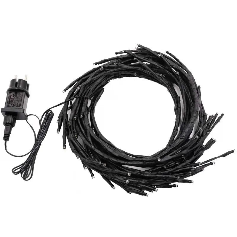 Flexible 2.3m vine light garland with 144 warm white LEDs and birch bark texture on a wall