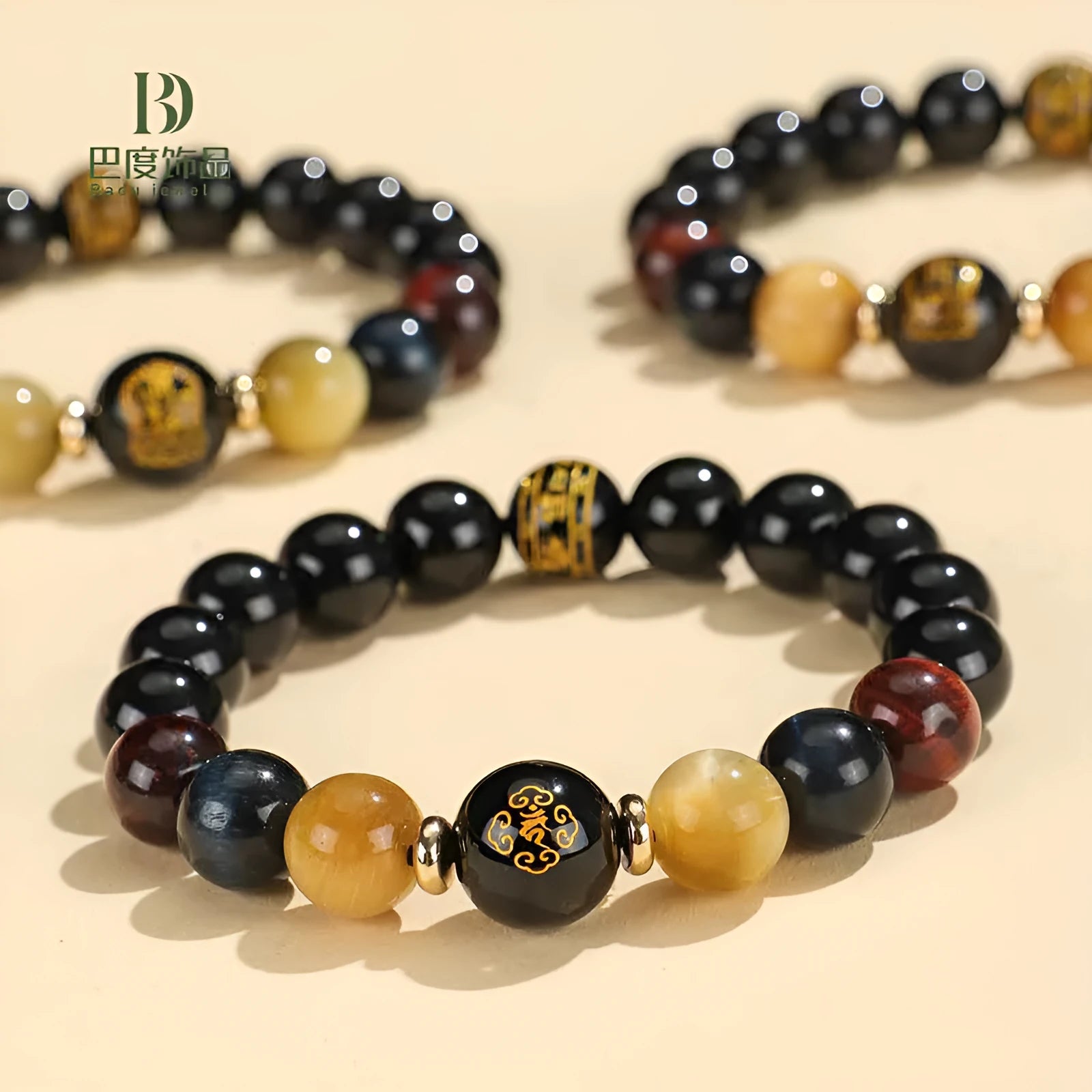 Black agate beaded bracelet with tiger eye stones in ethnic style on plain background