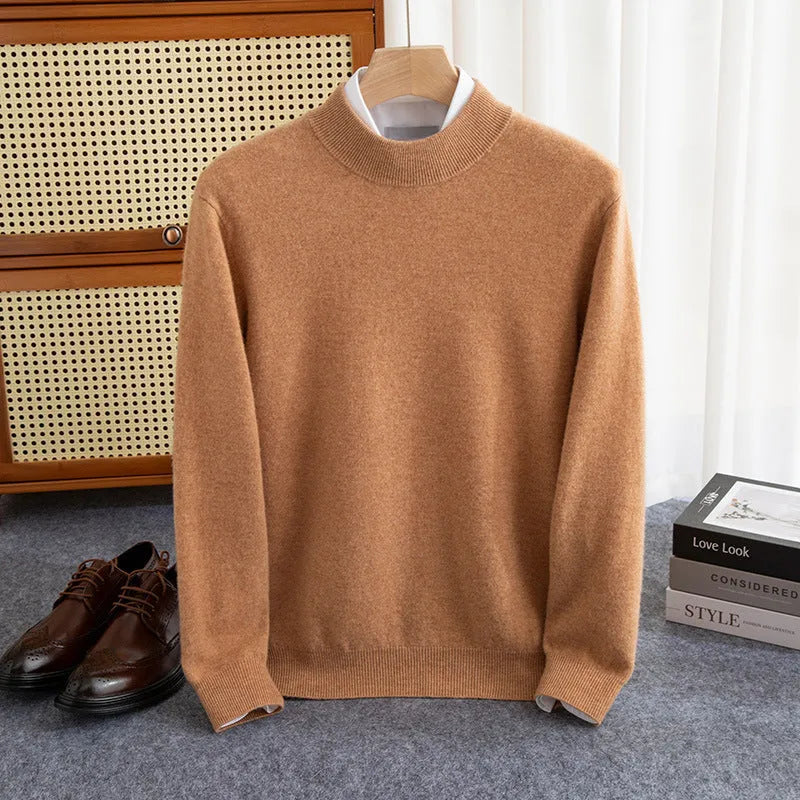 Man wearing a loose-fit half-turtleneck wool sweater in a neutral colour.