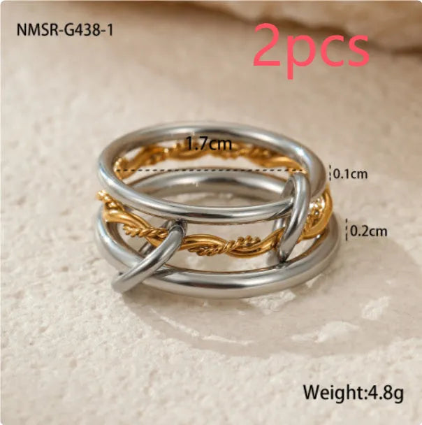 Gold plated stainless steel stacked ring set for women in an exaggerated free-size design.
