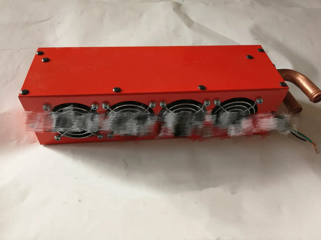 Metal car heater unit with long small four-hole copper pipe for 12V or 24V vehicle installation.