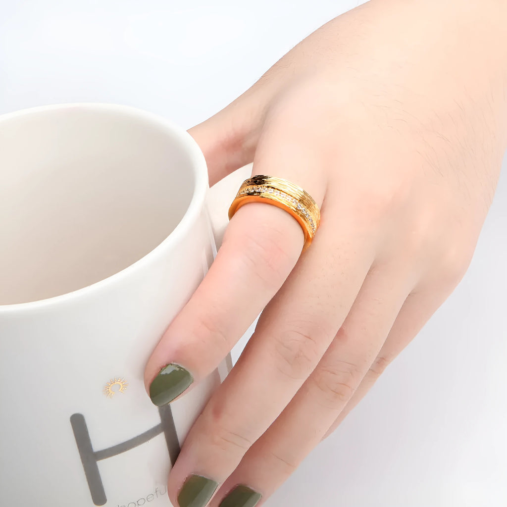 Gold geometric zircon ring for women on a copper base, shown in size 7.