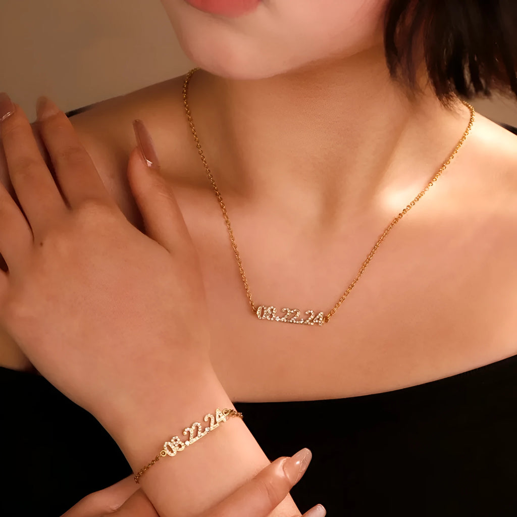Stainless steel digital bracelet with diamond studded numbers, shown in gold, rose gold and steel colour options.