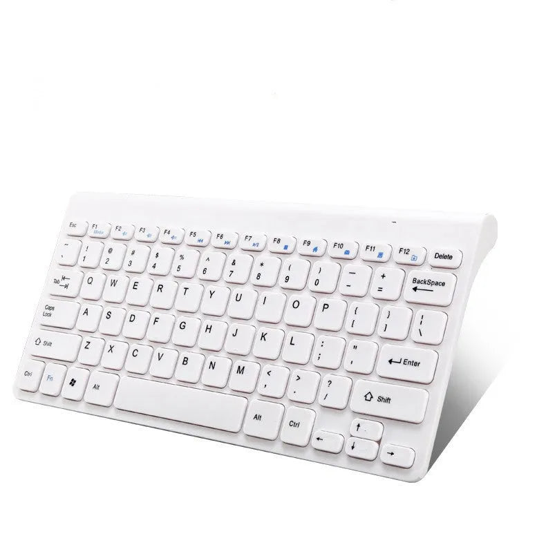 Black wireless keyboard and mouse set on wooden desk with USB receiver
