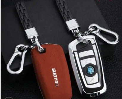 Suede key case with zinc alloy front frame in Classic Black, Charming Red, and Saddle Brown colour options
