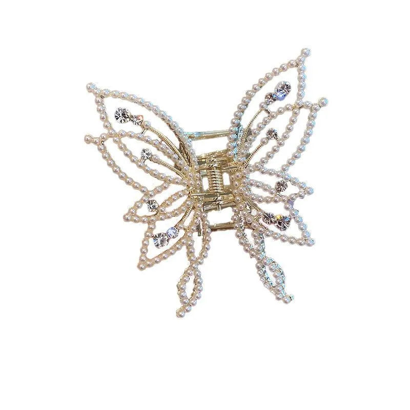 Butterfly-shaped alloy hair barrette for women with pearl or rhinestone decoration, shown from the front.