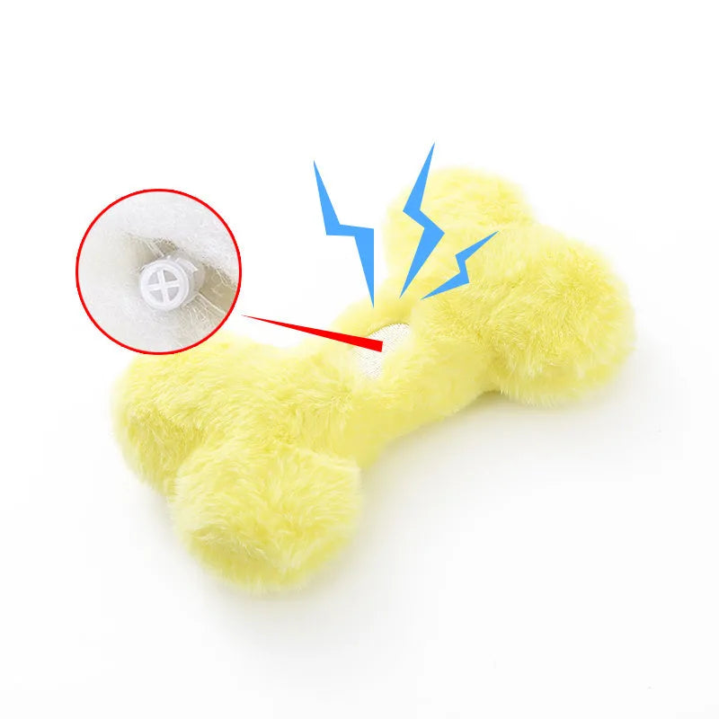 Blue plush bone dog toy with squeaker on a plain background.