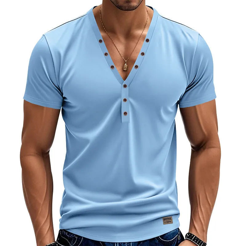 Man wearing a loose grey V-neck T-shirt with button detail on the front.