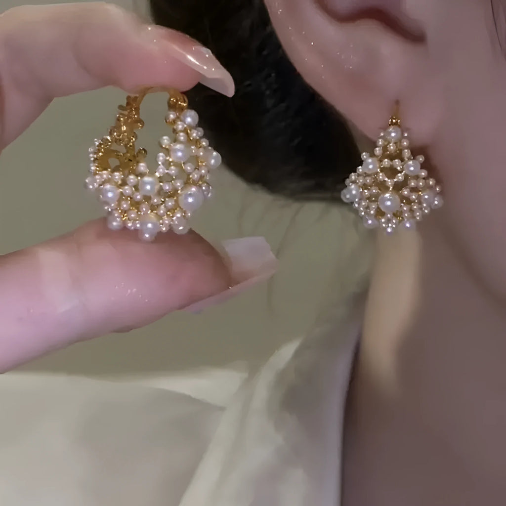 Women's gold-coloured copper flower basket earrings with small bead decoration and pearl inlay detail