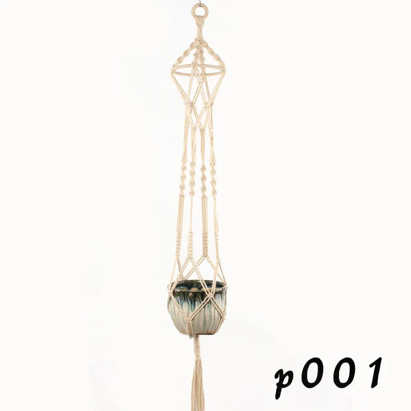 Woven cotton rope plant hanger in a hanging configuration holding a potted plant.