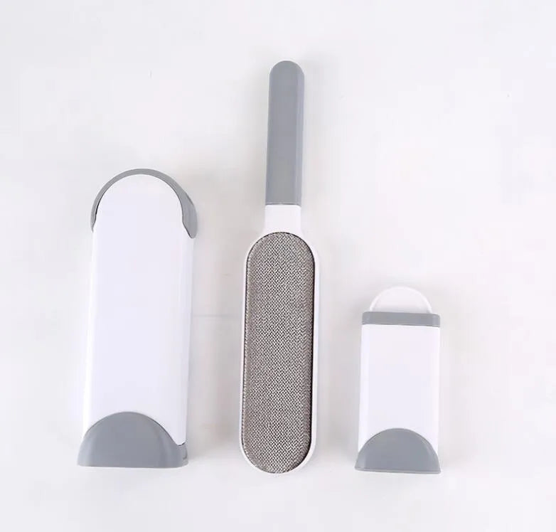 Blue reusable pet hair removal comb with a double-sided sticky brush head and a matching self-cleaning base.