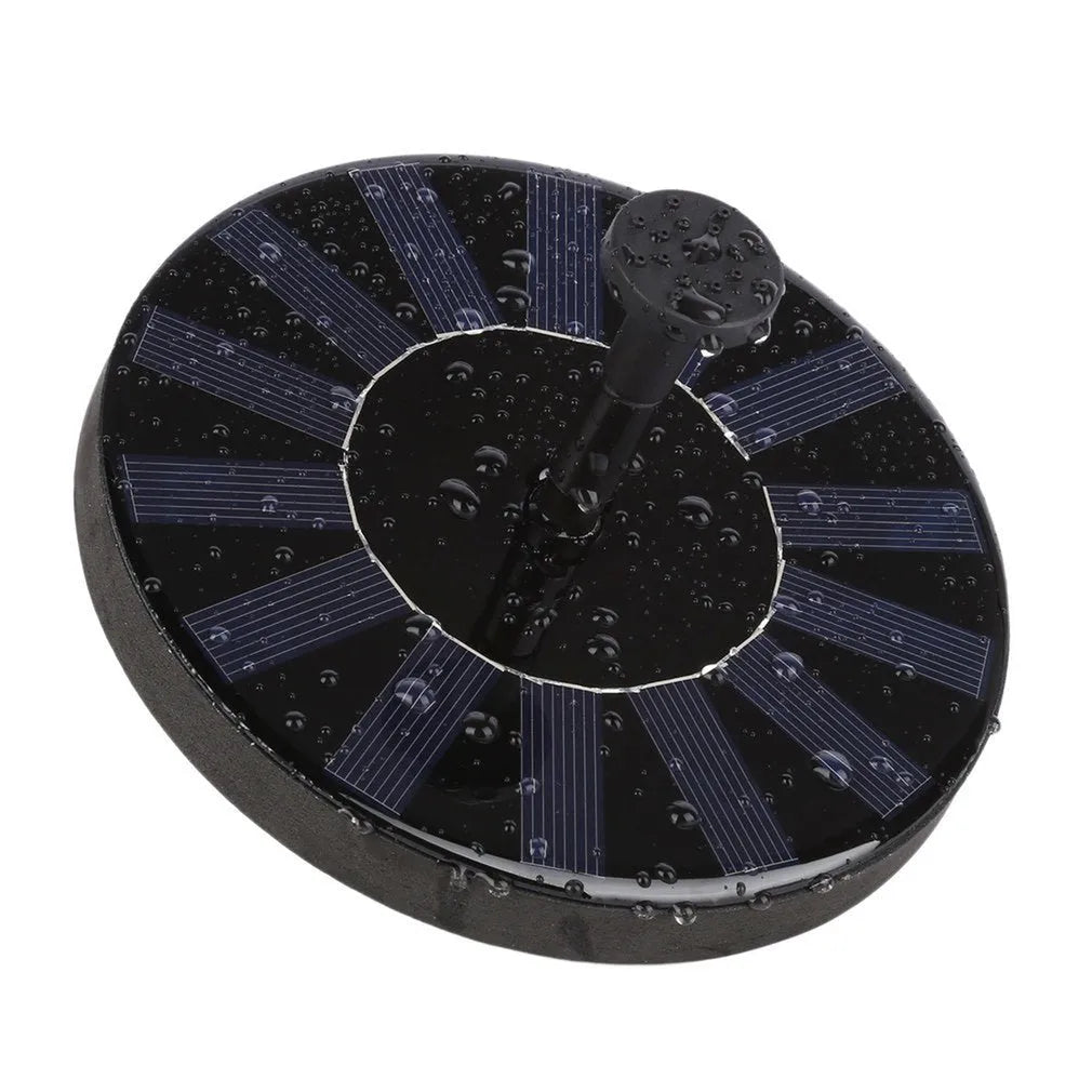 Black round solar fountain pump with 16cm diameter on a bird bath