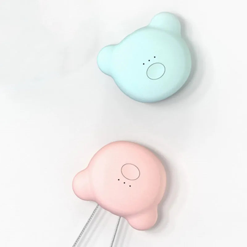 Mini USB rechargeable wearable air purifier necklace in pink, showing compact dimensions.