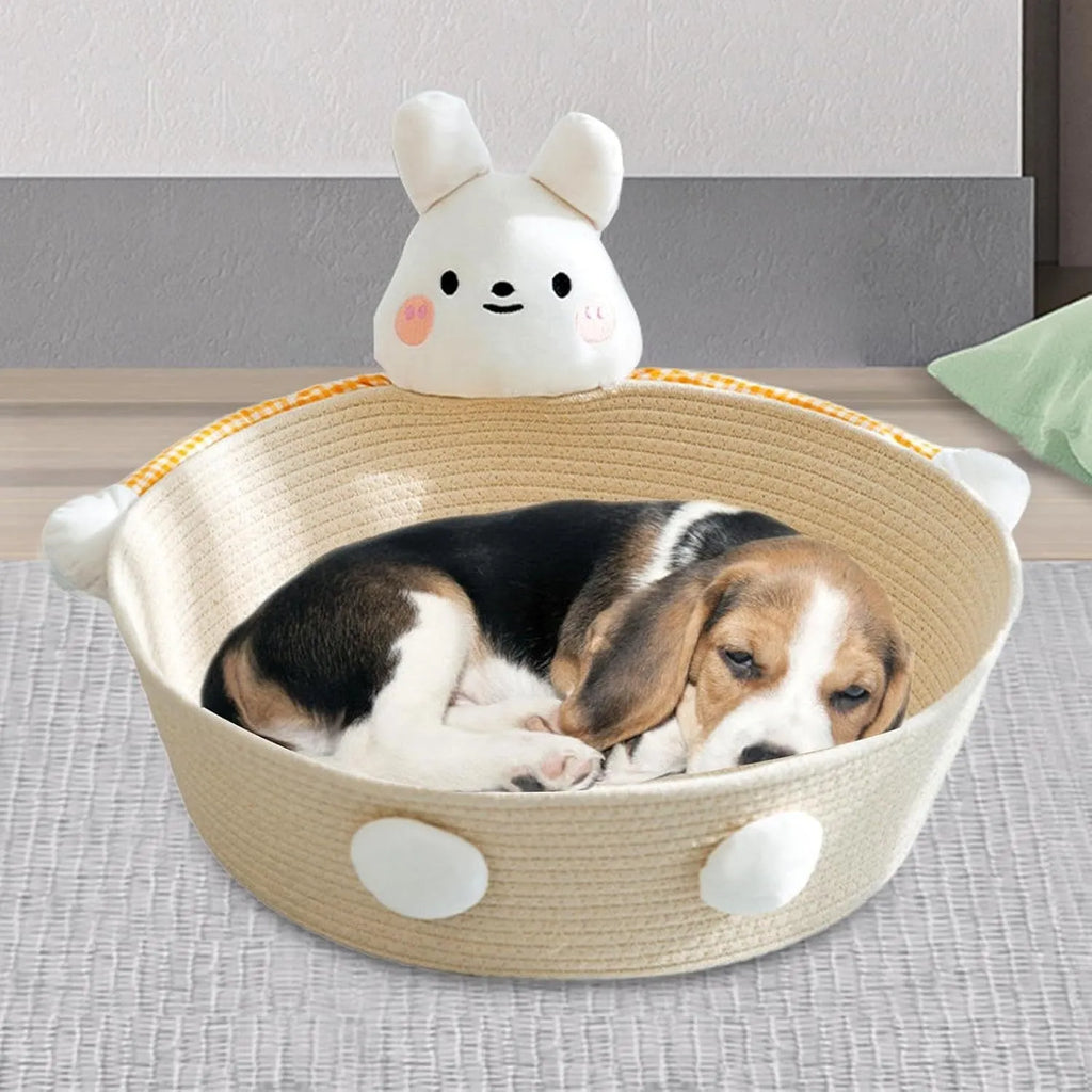 Woven cotton rope cat bed and scratching board basket shown in a home setting.