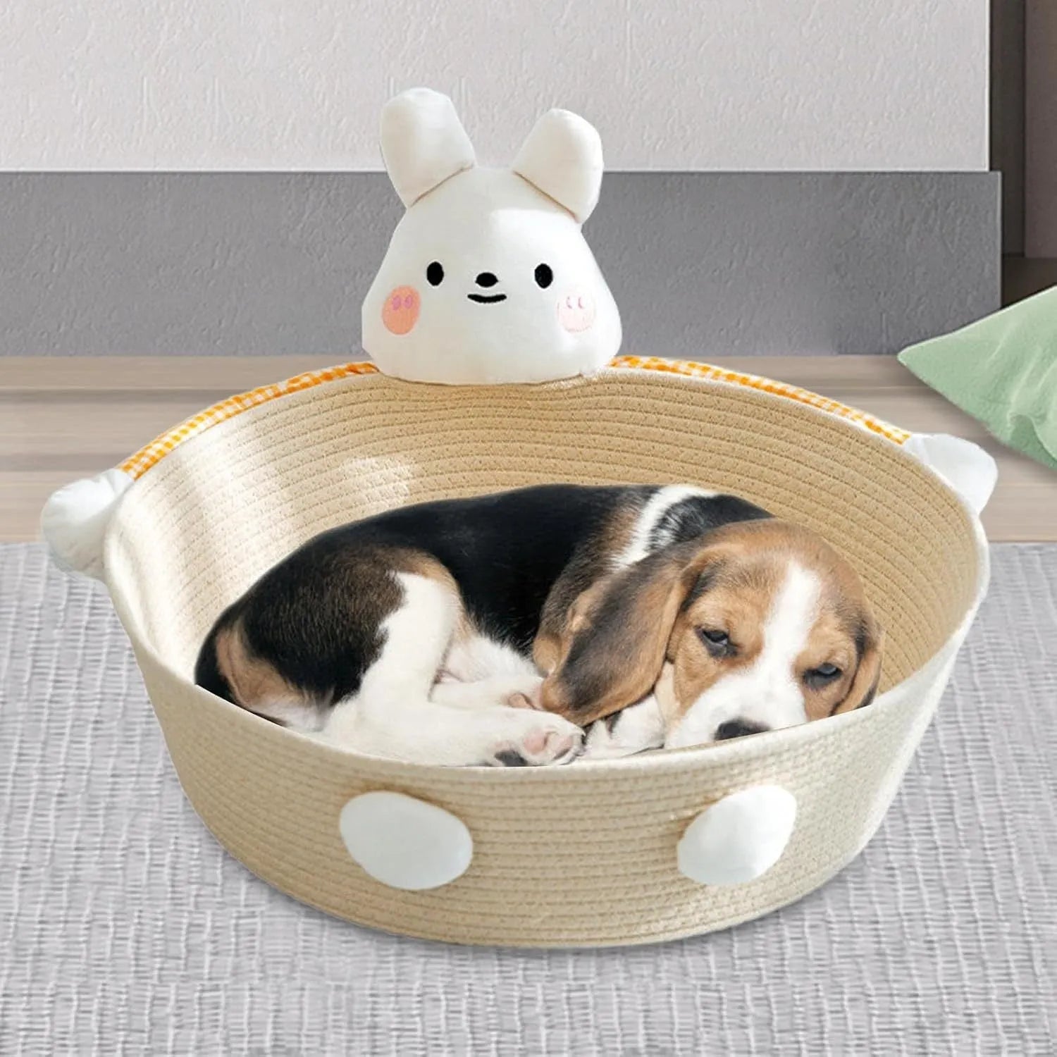 Woven cotton rope cat bed and scratching board basket shown in a home setting.