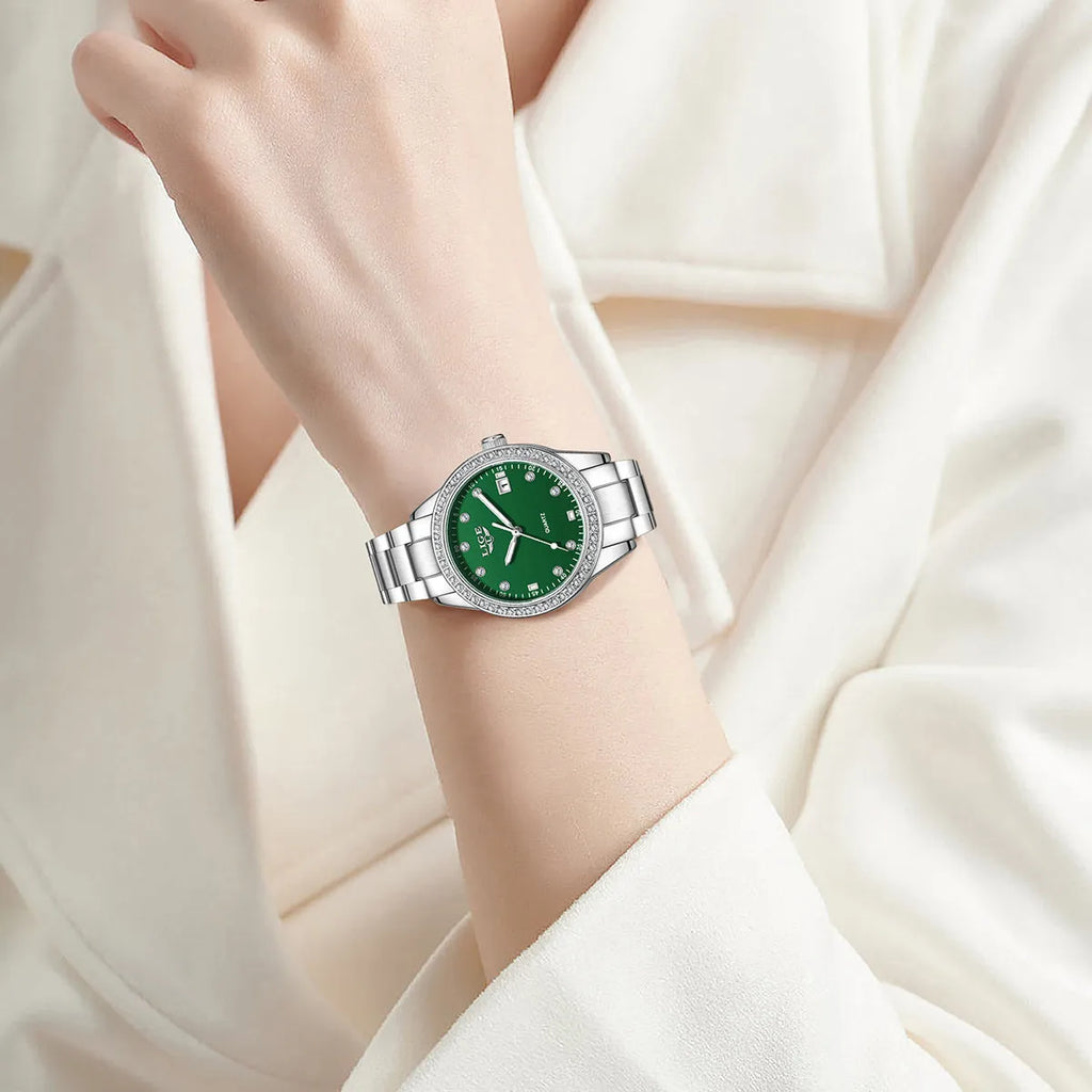 Silver stainless steel fashion quartz watch with diamond accents on dial, showing luminous markers.