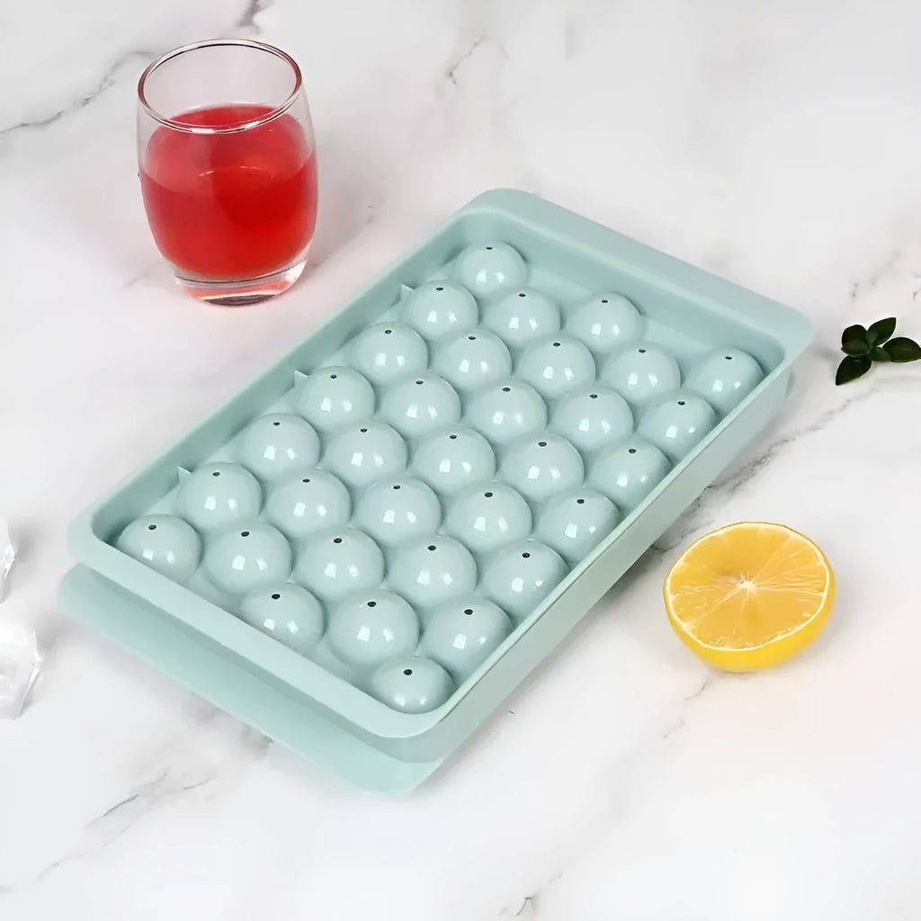 Blue silicone round ice cube tray with lid showing 33 grid design