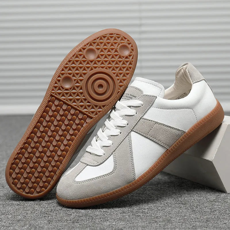 White Japanese-style retro unisex board shoes with mesh upper, rubber sole, and contrast stitching