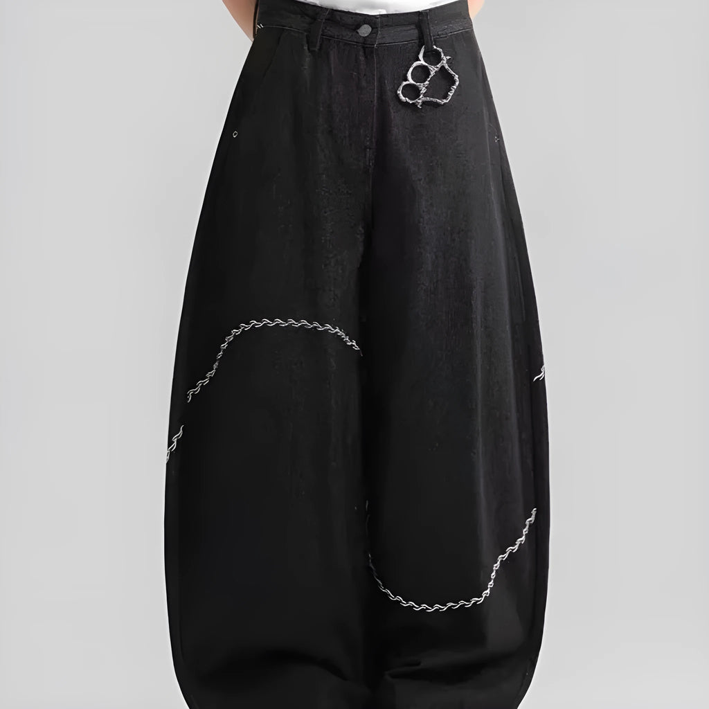 Black straight-leg denim trousers with mid waist and zip placket closure on hanger