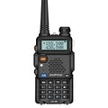 Baofeng UV5R portable walkie talkie in black plastic with antenna and belt clip